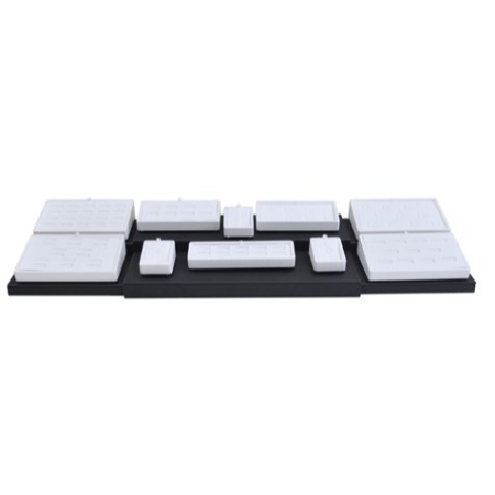 A black tray with white blocks on top of it.