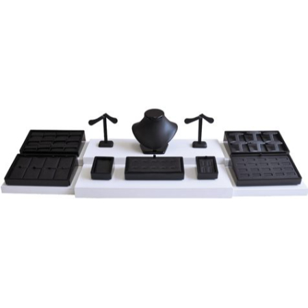 A set of black plastic objects on top of a white table.