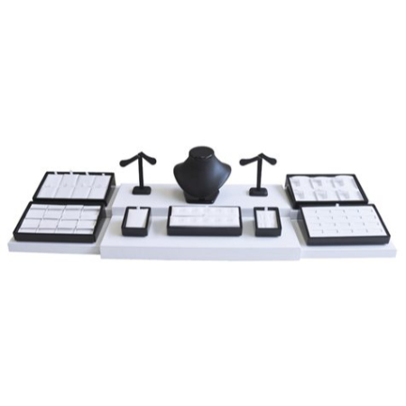 A set of four black and white computer keyboards.