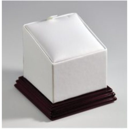 A white box with a brown base on top of it.