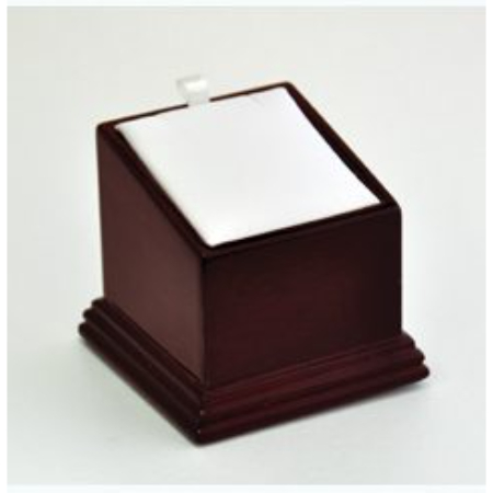 A wooden box with a white paper on top of it.