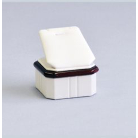 A white box with a brown lid sitting on top of it.