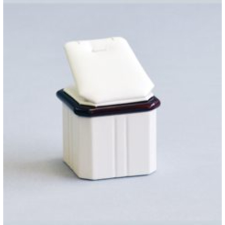 A white container with a brown lid sitting on top of it.