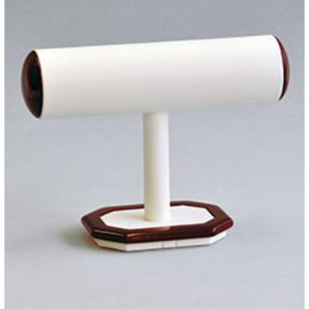 A white and brown t-bar holder on top of a table.