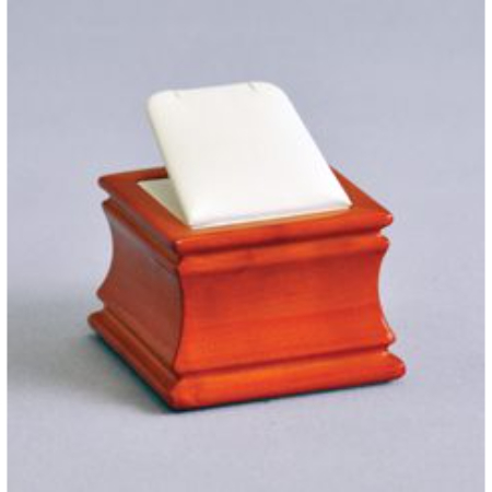 A wooden box with a white soap on top of it.