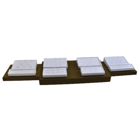 A set of four white plates on top of a brown tray.