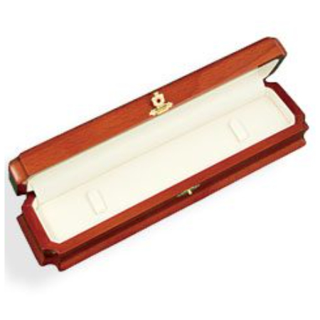 A wooden box with a white lid and a gold seal.