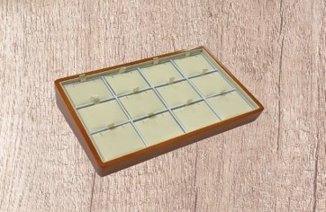 A wooden tray with 1 2 compartments on top of it.